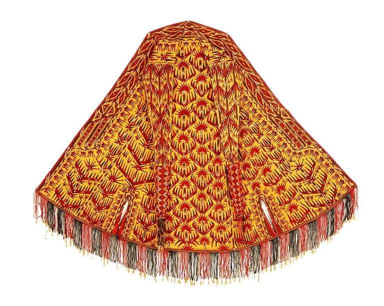 Chyrpies, Tekke Turkmen capes that are worn by women, are lavishly decorated with embroidery done in silk thread lacing stitch. The motifs are mostly stylized flowers, especially tulips, the most prolific wildflowers of the region. Often there are