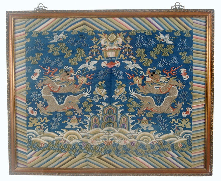 This is a fragment of a Chinese dragon robe, executed in kosu, or tapestry, weave.