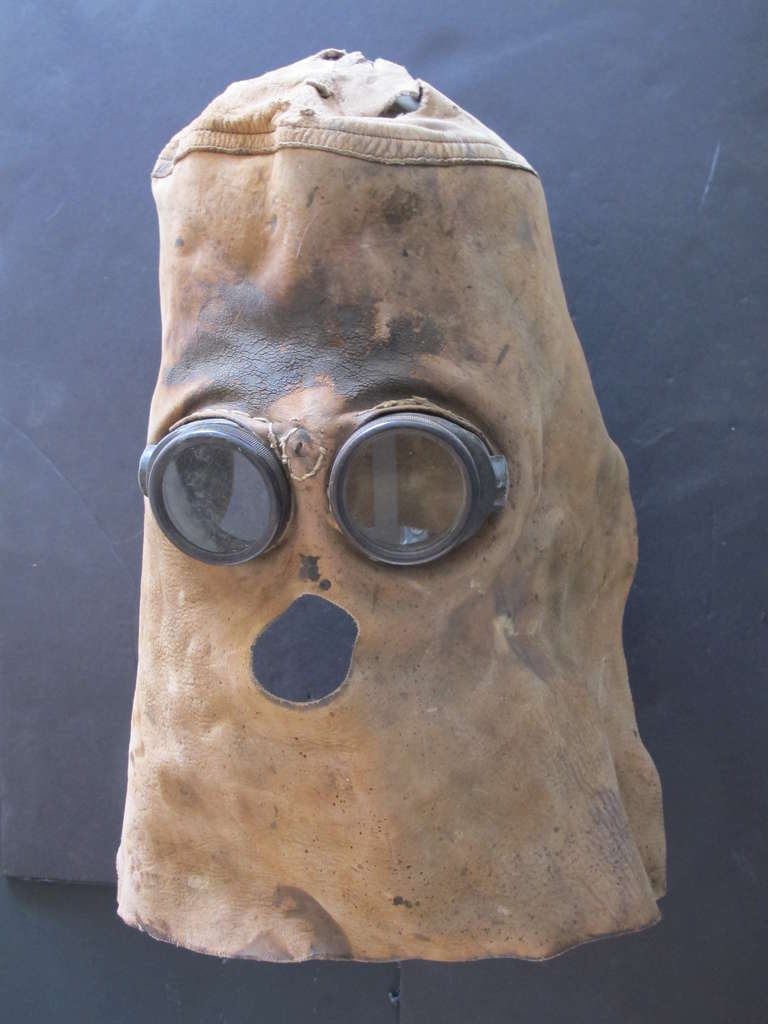 Hand made leather hood with welding goggles inset and mouth opening. The dark glass of the goggles would protect the eyes from the intense brightness of the welding flare and the leather served to protect from the sparks thrown off.
The mask
