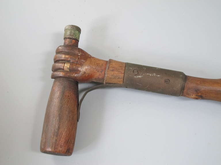 19th Century Hand Holding A Bottle Carved Cane For Sale