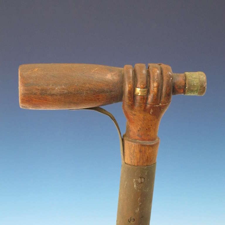 Hand Holding A Bottle Carved Cane For Sale 2