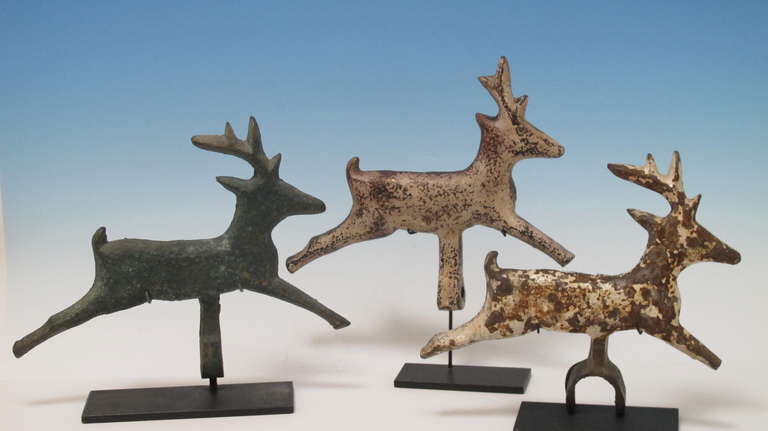 Unusual grouping of carnival shooting gallery targets made to be knocked over when hit. These were probably made by different makers of arcade targets in the last century as they are similar forms with variations. The deer would have been pulled by