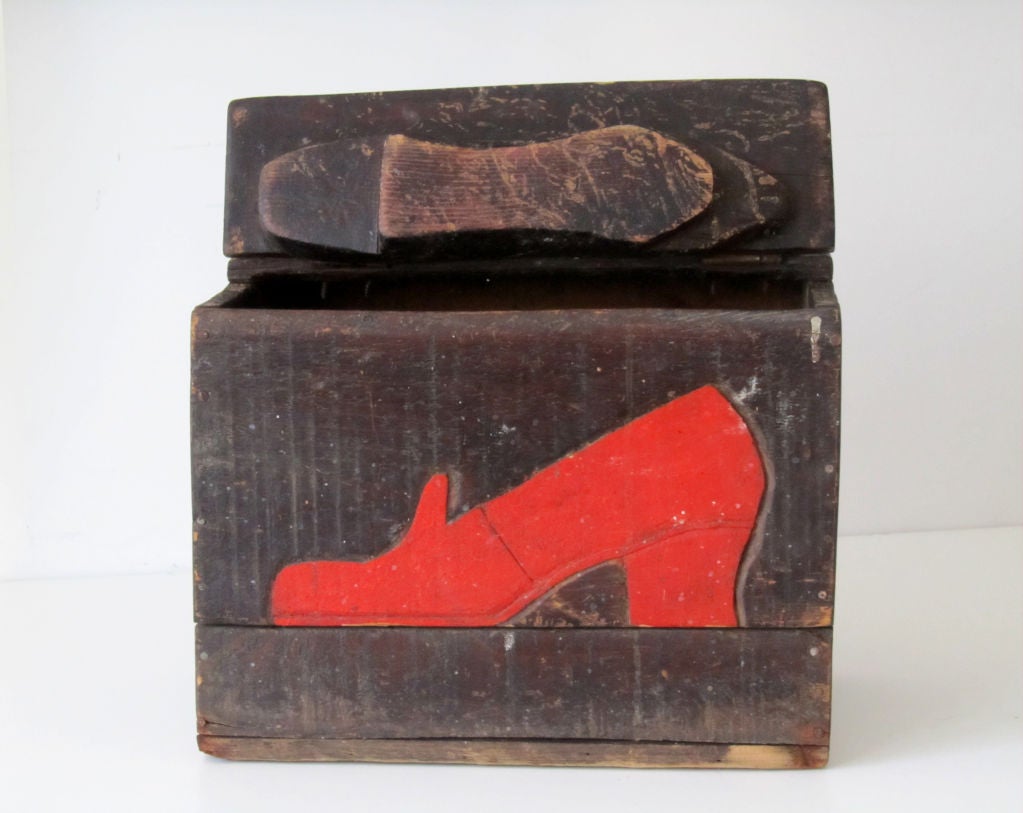 An outrageous red shoe adorned this humble shoe shine box elevating to folk art status.  Would the lady with red shoes return? Who was the man so obsessed? Who else will have to have it after Peter Brams?
