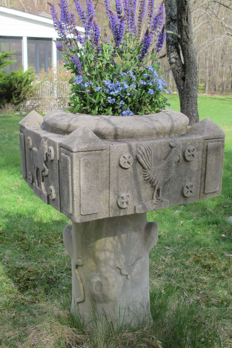 Limestone planter carved in two parts with the top having relief images of a horse, cows, rooster, and incised date of 1929 on the sides. Circular planting hollowed center with drain holes. The square top piece has corner columns with pyramided