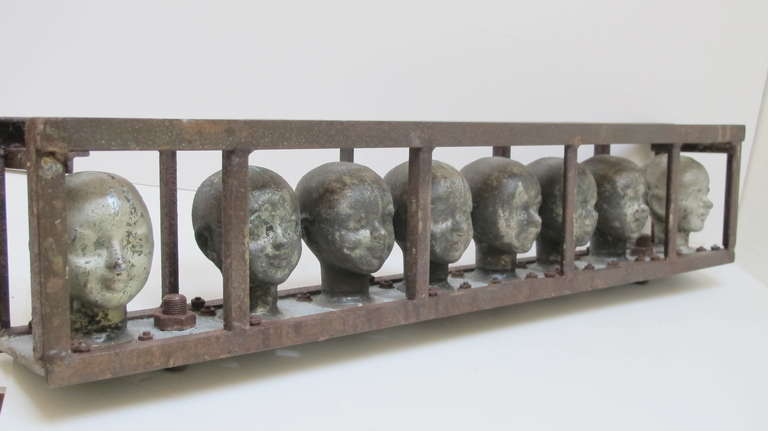Doll Head Molds in a Metal Frame 2