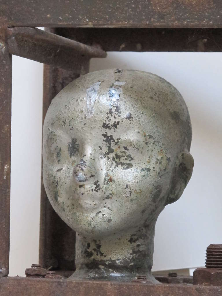 Mid-20th Century Doll Head Molds in a Metal Frame