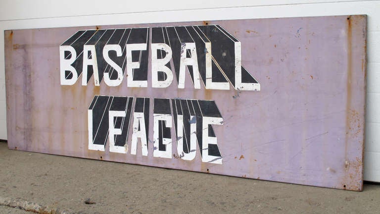 Well painted baseball sign from Barberton, Ohio.  Dramatic graphic painting on tin, with turned edges to give the sign strength and depth.The lettering style suggests dimensional lettering. The long sign can be reduced in length on request.