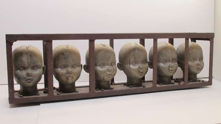 American Series of Large Doll Head Molds in Iron Frame