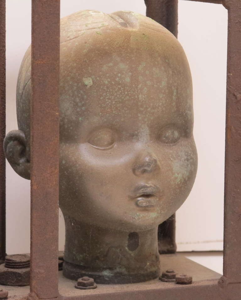 Series of Large Doll Head Molds in Iron Frame In Excellent Condition In New York, NY