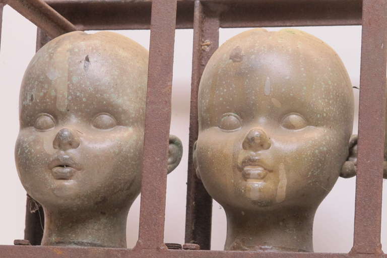 Industrial Series of Large Doll Head Molds in Iron Frame