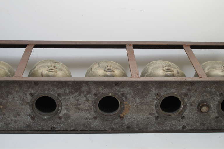 Series of Large Doll Head Molds in Iron Frame 2