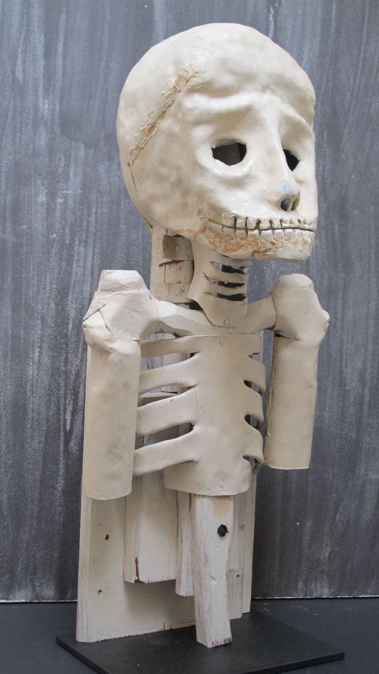 Half skeleton made from wood and sheet lead with paint. This would have been set into a fake coffin ias a reminder of the shortness of life in the lodge ceremonies.  Unusually made and proportioned . It reminds me of Beavis & Butthead.  West Texas