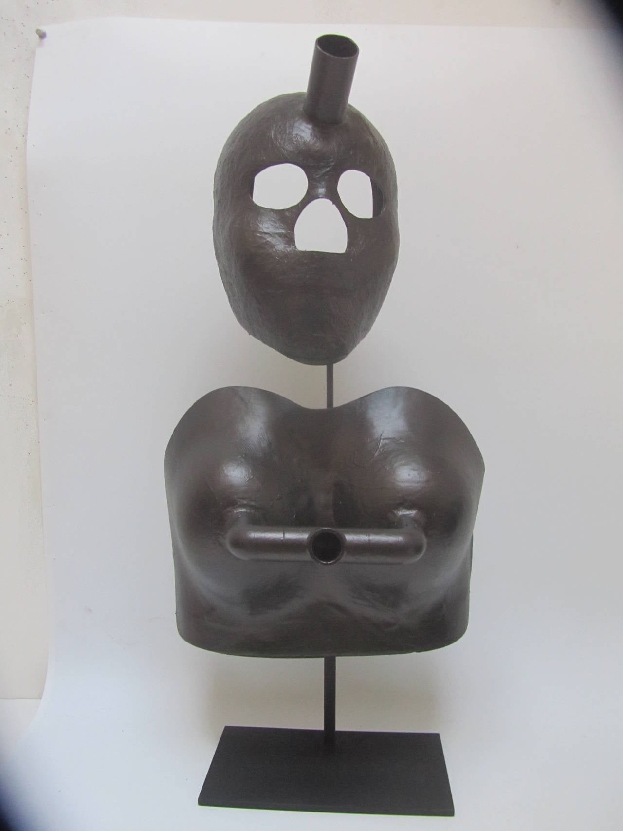 Unusual abstract forms for making female mannequin forms. Mounted together over a black metal base.