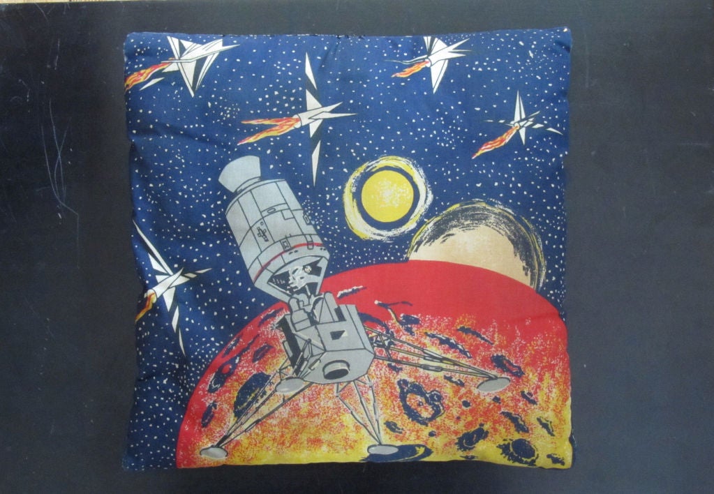 Space explorer pillow with hidden pocket below pilot and celestial image on the reverse with rockets and spaceship. Buck Rogers inspired printed fabric from the early days of rocketry and science fiction.