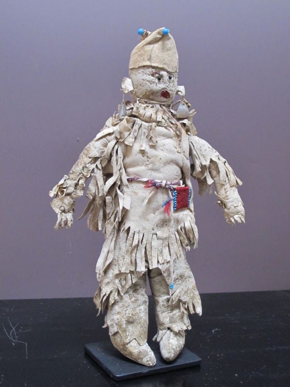 This rare doll was made for a Paiute child. It was sewn primarily of brain tanned deer hide with trade cloth attachments, beads and is sewn with both cotton thread and sinew. The Paiute Indians are people of the Great Basin - western Utah, northern