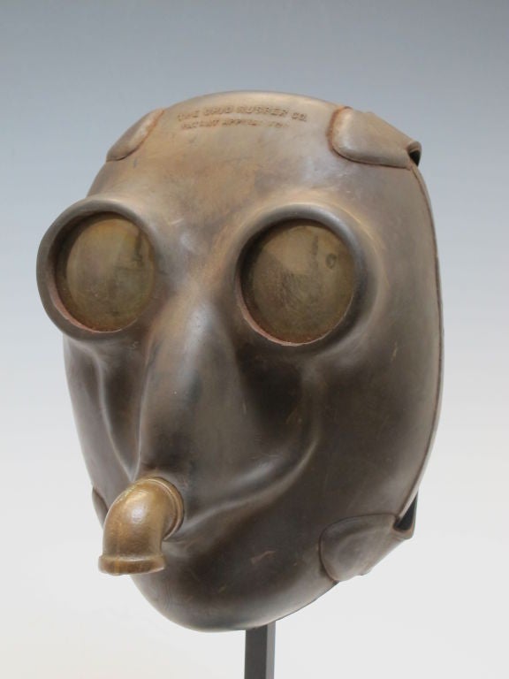 Remarkable sculptural mask for shallow diving of rubber with yellow toned lenses and brass fitting for air hose.  Ohio Rubber Co. This mask was patented in 1941 for use in diving by Victor Berge (1891-1974)and used by the Navy during WW11. Victor