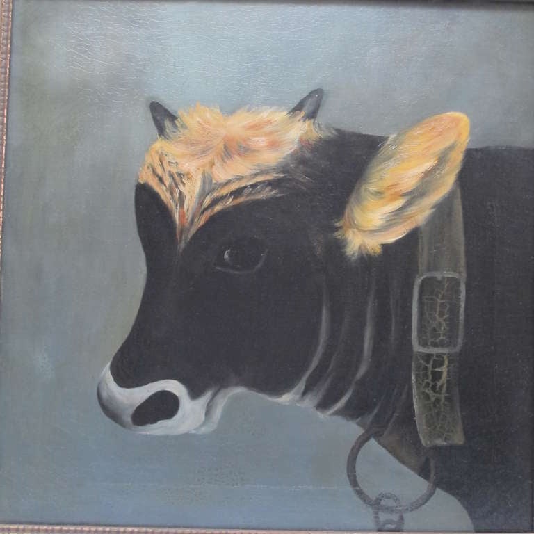 Lovingly painted portrait of a black cow with honey colored forehead and ears. The unsigned painting is oil on canvas in an old frame. The painting was cleaned as it had darkened varnish and it has areas of crackling to the paint visible in the 2