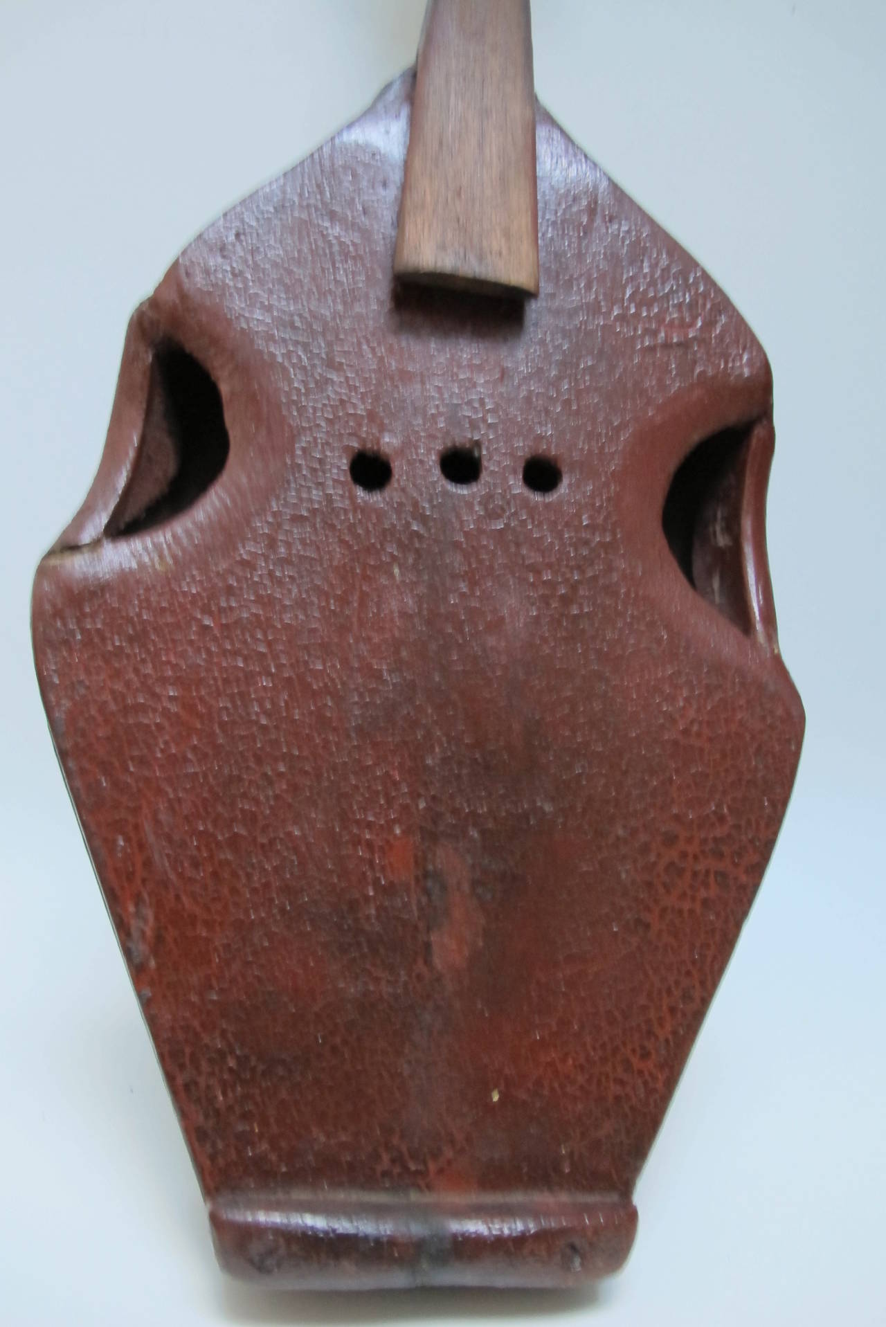 An unusual homemade Virginia fiddle incorporating a small fry pan in the body.
Other parts of the fiddle are wood including the neck and it has a painted finish with some paint alligatoring.