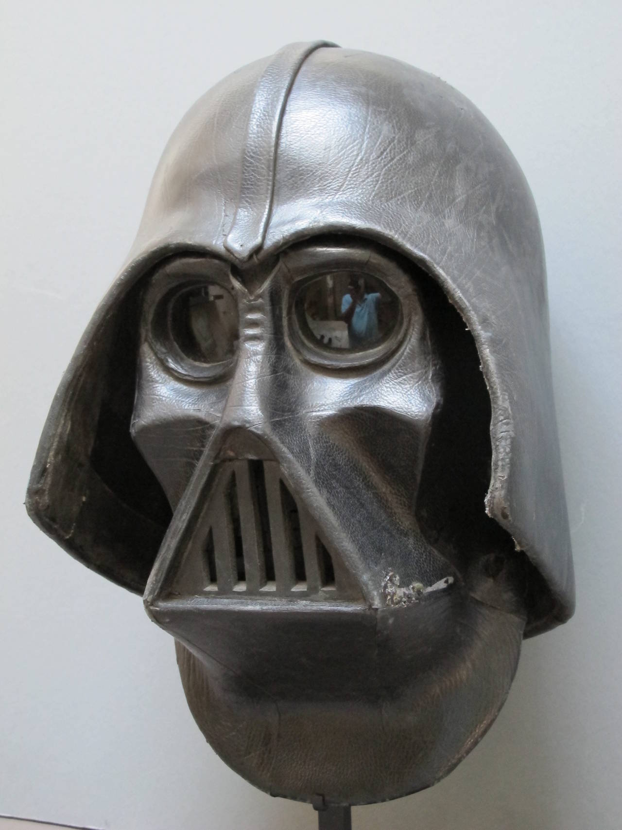 Extremely well made mask and helmet with leather covering. Made to be worn with straps in the back of the mask and padding. Possibly an early Star Wars costume made for the yearly gatherings. Correctly proportioned and made durable with attention to