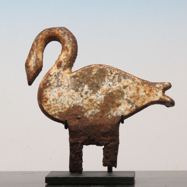 cast iron shooting gallery target mounted on metal base.