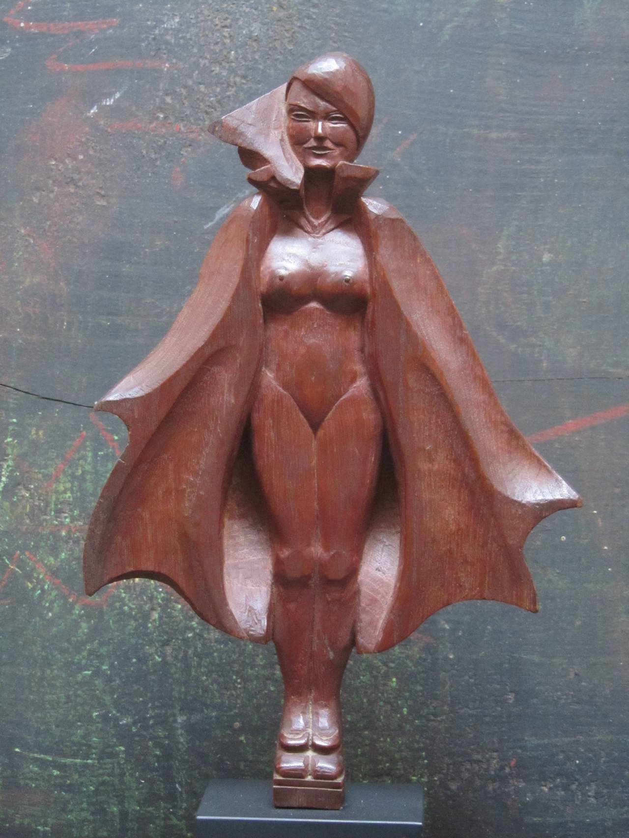 A fantasy carving of a woman in a cape revealing herself. I don't know who the carver was but would date it to the 1930s. The way the billowing cape frames the figure is what makes this folk sculpture spacial and gives her mystery. Unusual also from
