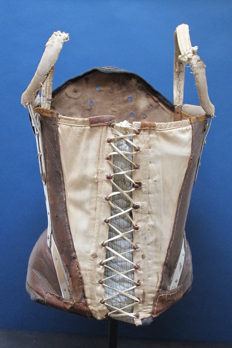A 19th c.leather corset with nickel plated iron braces riveted to the leather. Finely crafted with air holes and cotton canvas lace up front and straps, made to help support the back and upper body. Frida Kahlo had to make use of elaborate leather
