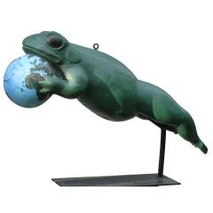 Giant Frog Holding A Globe Shop Sign