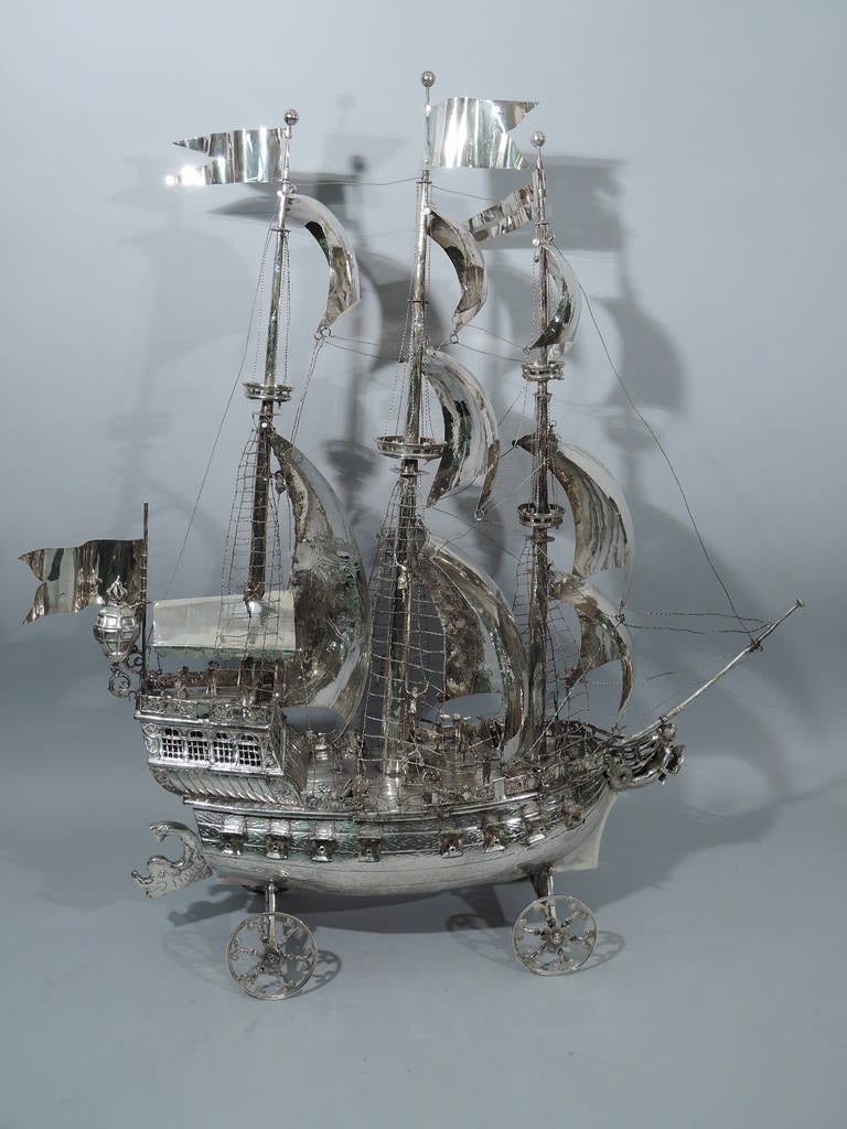 German sterling silver three-mast ship. Imported to Chester, England by Berthold Muller in 1903. A very large model of an old three-mast warship in battle. Sailors wield weapons, climb rigging, and fall in agony. The gun ports are open. The captain