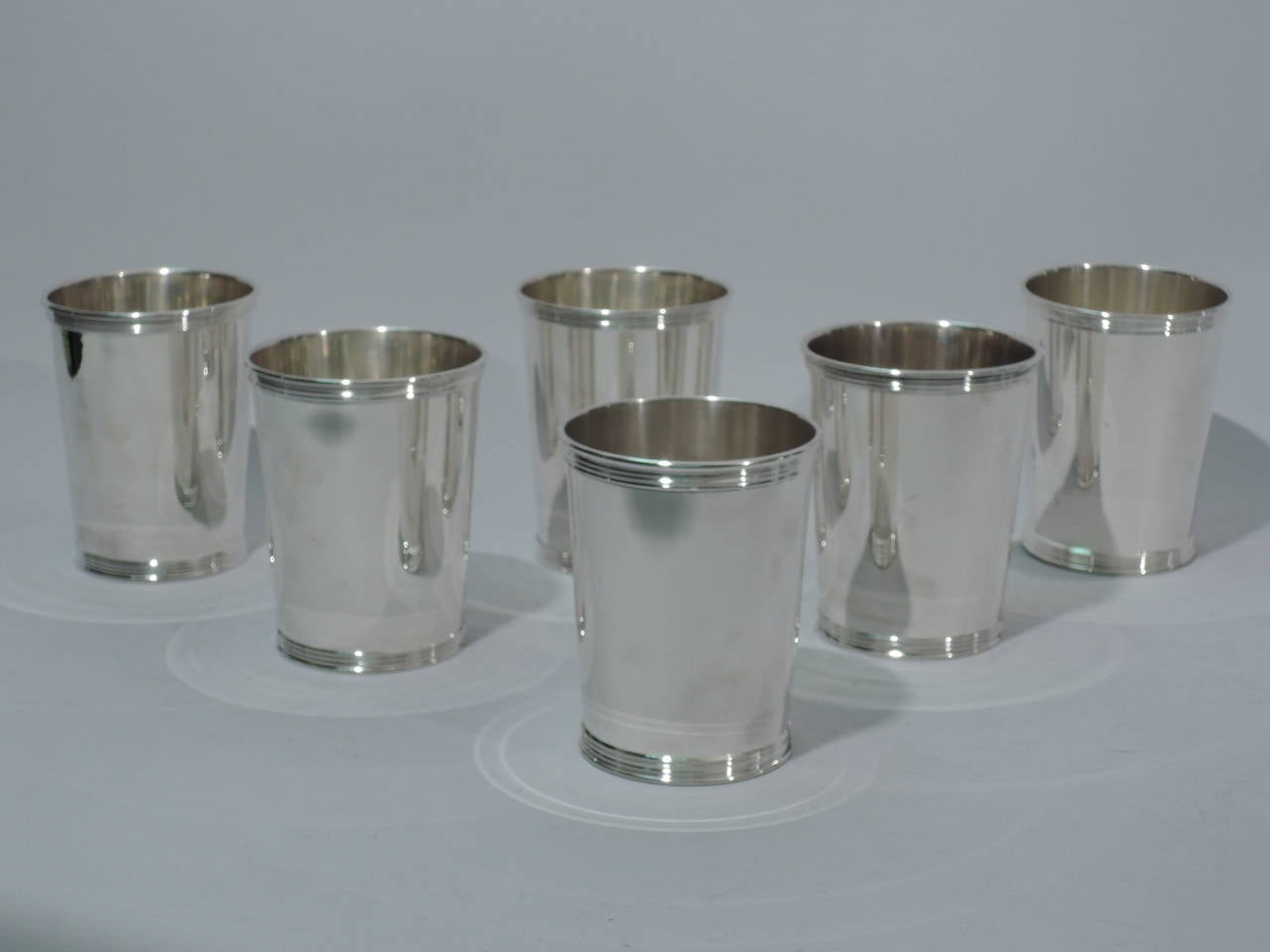 Set of 6 sterling silver mint julep cups. Made by Manchester in Providence, ca. 1950.Each straight and tapering sides, and reeded rim and foot. Hallmark includes no. 3759S. Excellent condition.

Dimensions: H 3 3/4 x D 3 in. Total weight:25.3 troy