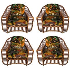 A set of four (4) c. 1970's teak and rattan chairs