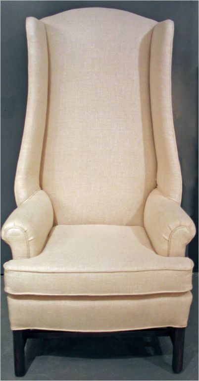 CON22769    <br />
A c. 1960's wing chair. Solid mahogany frame w/ Marlborough legs. Stylish enhanced back height w/ streamlined wings. Completely re upholstered in linen.    <br />
 54.75 in. H x 29 in. W x 27 in. D