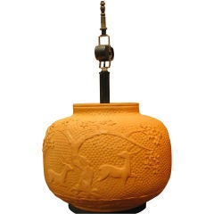 A French Art Deco lamp in terra cotta