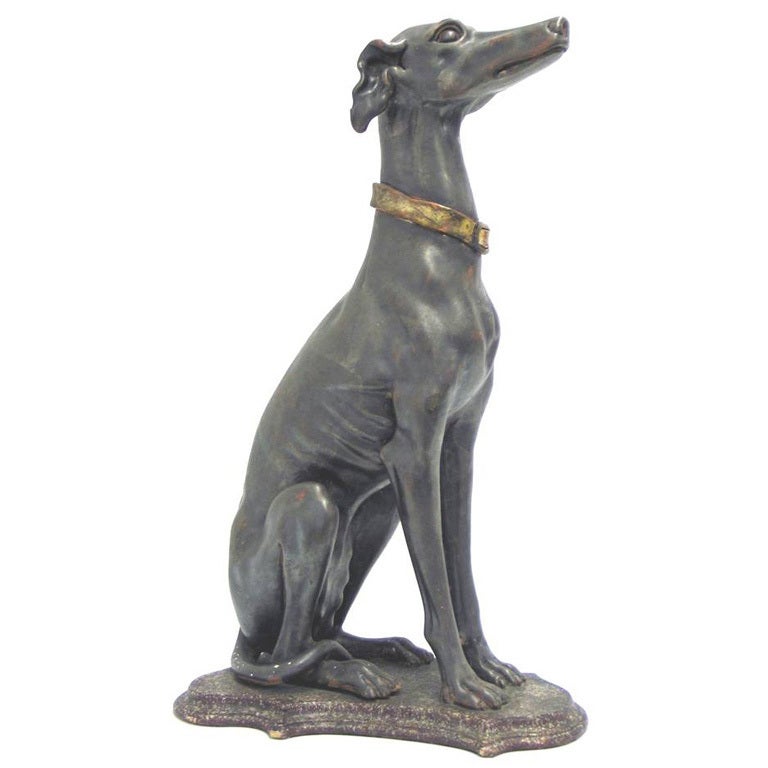 C23917 
A pair of c. 1950's Italiante whippets. Grande Tour pieces, hand carved of wood overlaid in bronze and gold leaf with faux porphry bases                               30.50 in. H x 18 in. W x 12 in. D.