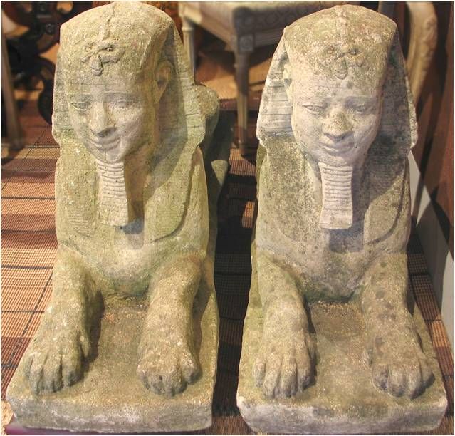 C20507   ARDL<br />
A pair of c. 1920's Bahamian sphinxes. Each of these cast stone and sea shell sphinxes have age old patination and lichen coverings.  <br />
 21 in. H x 12 in. W x 38 in. D