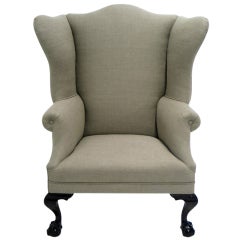 Antique A curvaceous  English wing chair