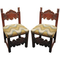 A pair of mid 19th.c. Italian fireside chairs