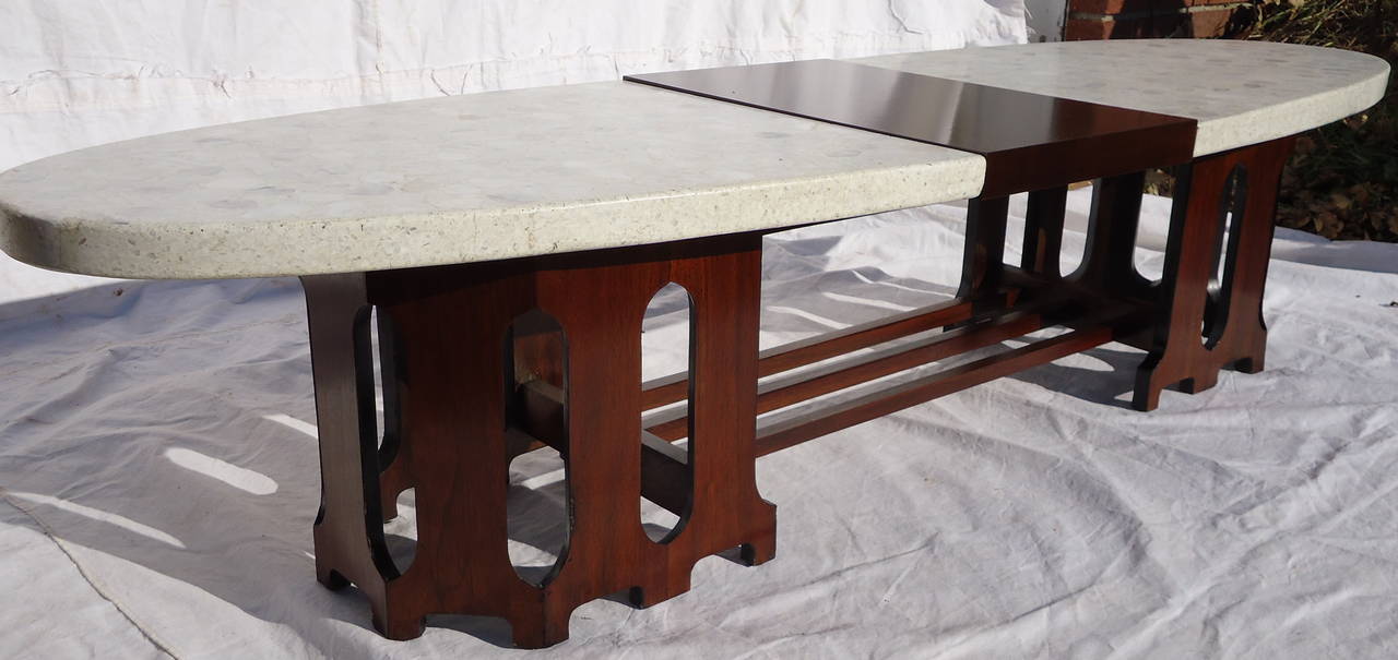 Harvey Probber style elegant coffee table with surfboard top of Terrazzo marble divided by a center panel of black walnut.
The table measures: 15