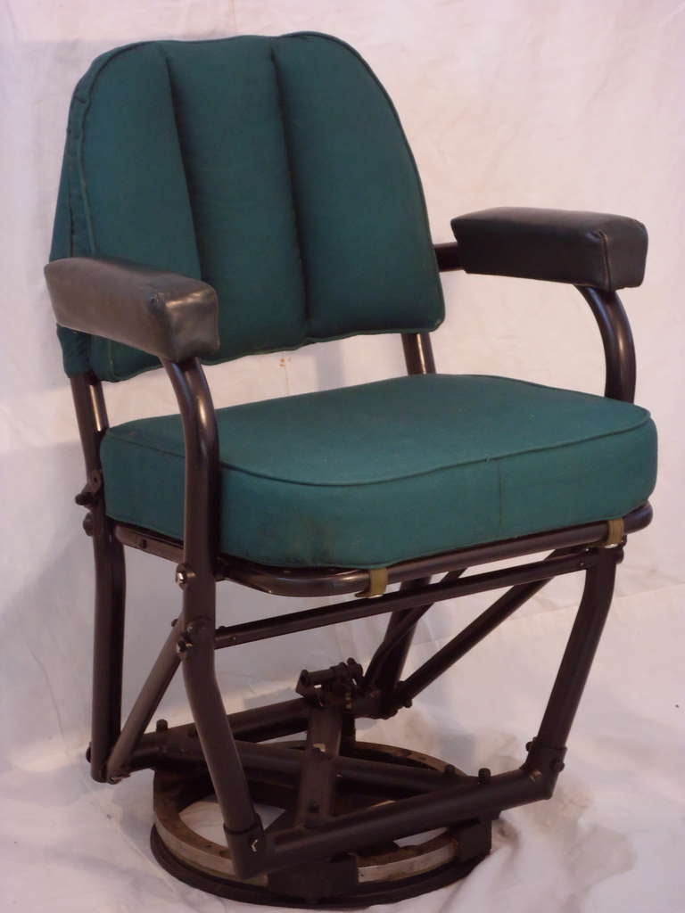 Warren McArthur (Model 364)  rare and unusual revolving navigator's seat designed in 1947 for the Grumman Aircraft Co.'s XJR2F known as the Albatross. 
This would make an interesting desk chair. Originally upholstered in Amazon Green leather as the