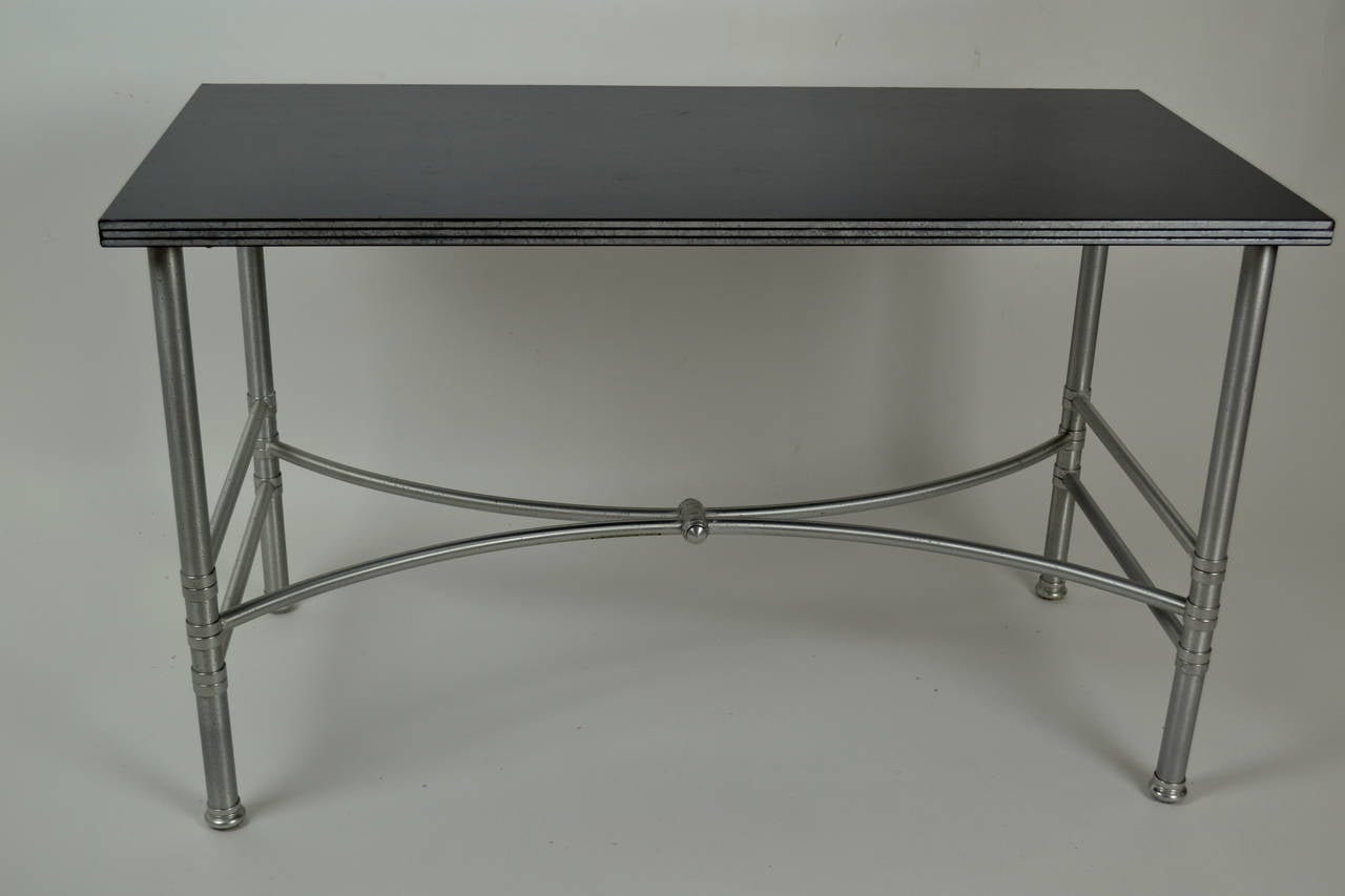 Warren McArthur cocktail or coffee table with original banded formica top and turned aluminum feet. 
Originally sold in 1938 for $32.00 as Style No. 1513. 
In keeping with one of Warren McArthur's basic design priorities the standardization of the