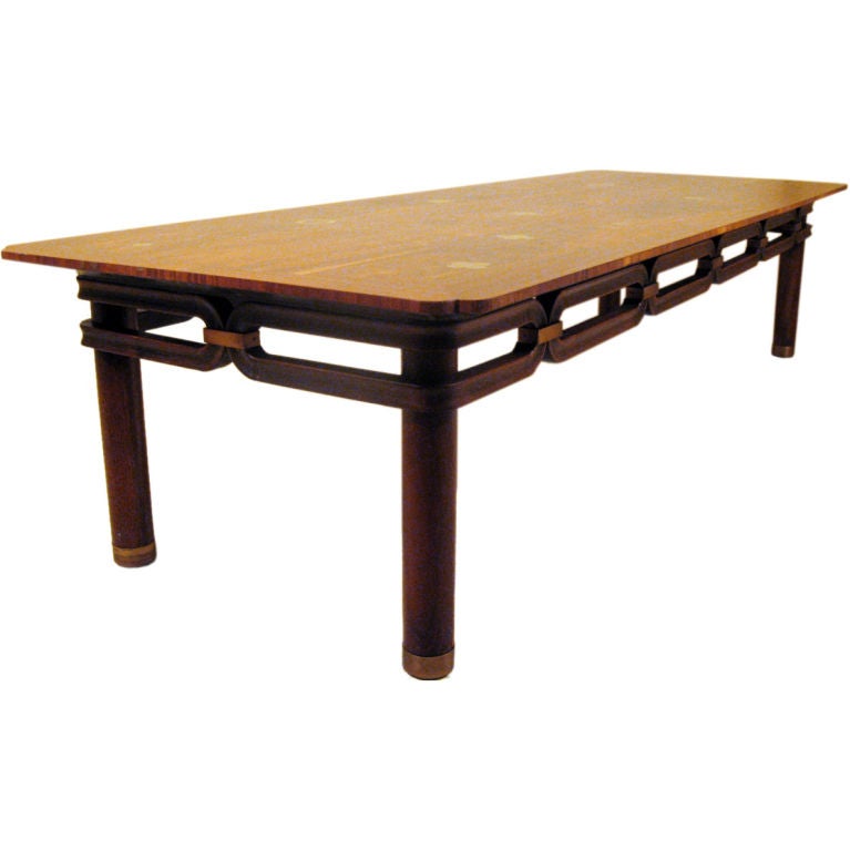Unusual coffee table designed by Bert England as part of his Forward Trend Collection for the Johnson Furniture Company, circa 1960. 
Brass inlays and an interesting trim of carved walnut links. Labeled
The table is in excellent vintage condition