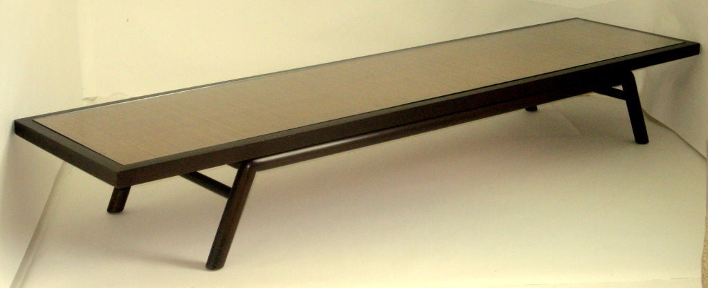 An elegant 8' T.H. Robsjohn-Gibbings coffee table with a glass panel over a caned insert manufactured by Widdicomb in 1954.

The espresso color was a custom order in according to the original owner. 

The table has been professionally restored