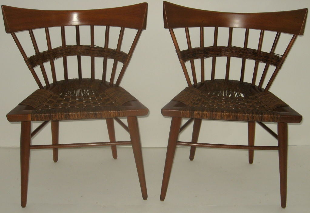 A pair of vintage Side Chairs by Edmund Spence for his Mexican manufacturer Industria Mueblera c. 1952. The solid mahogany framed spindle back chairs with their original woven sea grass seats and sea grass banding are unusual combination when viewed