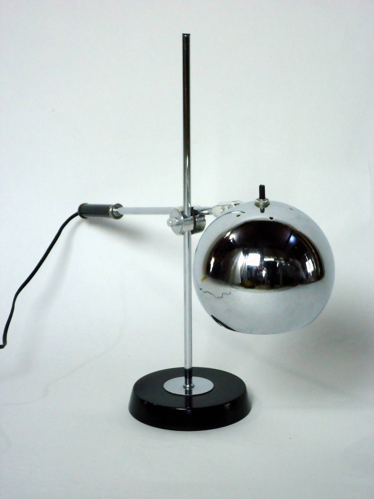 Adjustable chrome table or desk lamp by Robert Sonneman, circa 1965.

The lamp has been professionally rewired and is in excellent condition.