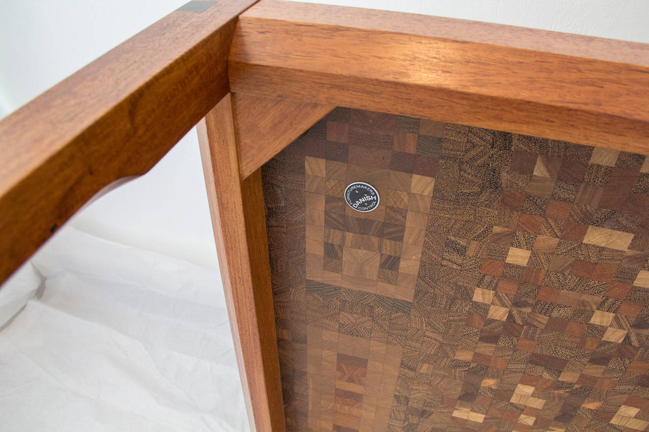 Carved  Danish, Coffee Table by Tranekaer composed of exotic hard Woods, 1970s For Sale