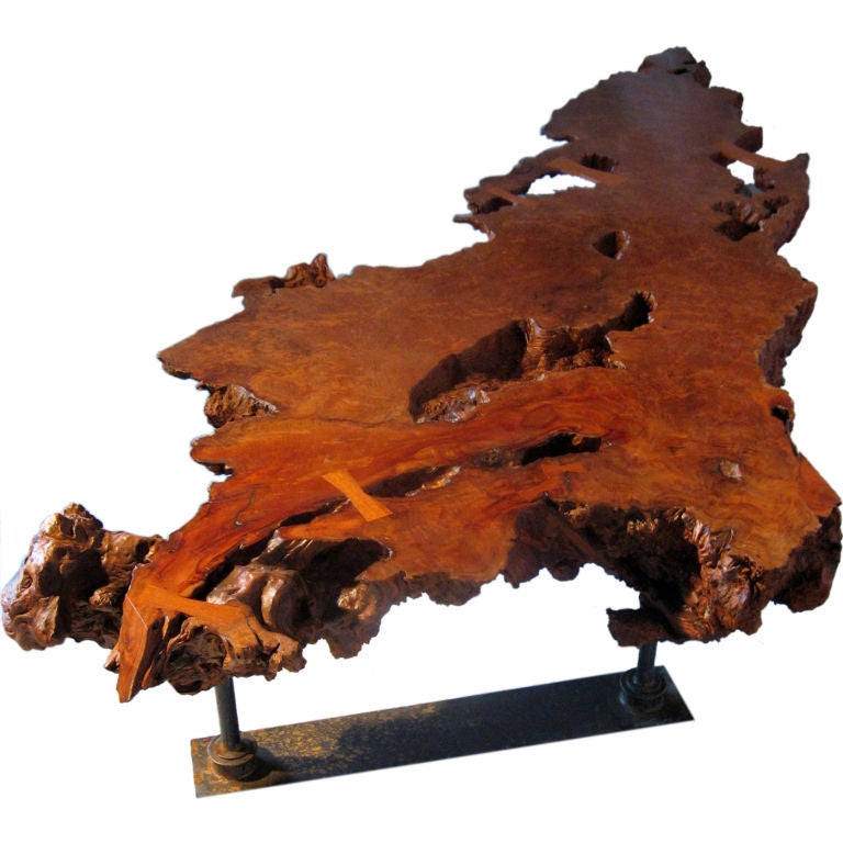 A 1960s Oregon redwood burl coffee table that had been a single slab of burl that was cool but really low. 
The table had warped with age and the finish was gone. 
I hand planed the top for 65 hours in the Camden, Maine studio of Phi Designs.