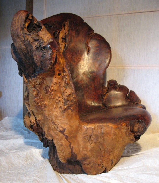 Massive redwood burl chair that has been carefully hand-shaped to create a sculptural form with great color and surface. 
Carved in the late 1990s in the craft studio of  a talented Californian craftsman, Clifford S. Short (1937-2016) which was