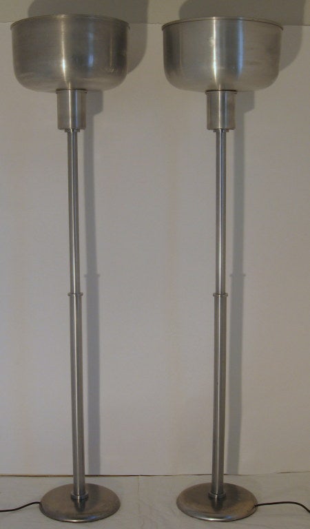 Uncommon pair of Warren McArthur commercial floor lamps. These torcheres were used in large department stores and theaters in the 1930's.
The lamps have been professionally rewired and are in excellent vintage condition.
