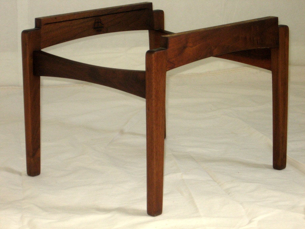 This classic side table was crafted from black walnut at the studio of  Arden Riddle in 1968. The design of this base and the use of a slightly off white travertine marble top is reminiscent of the work of Adrian Pearsall and Vladimir Kagan. 
The