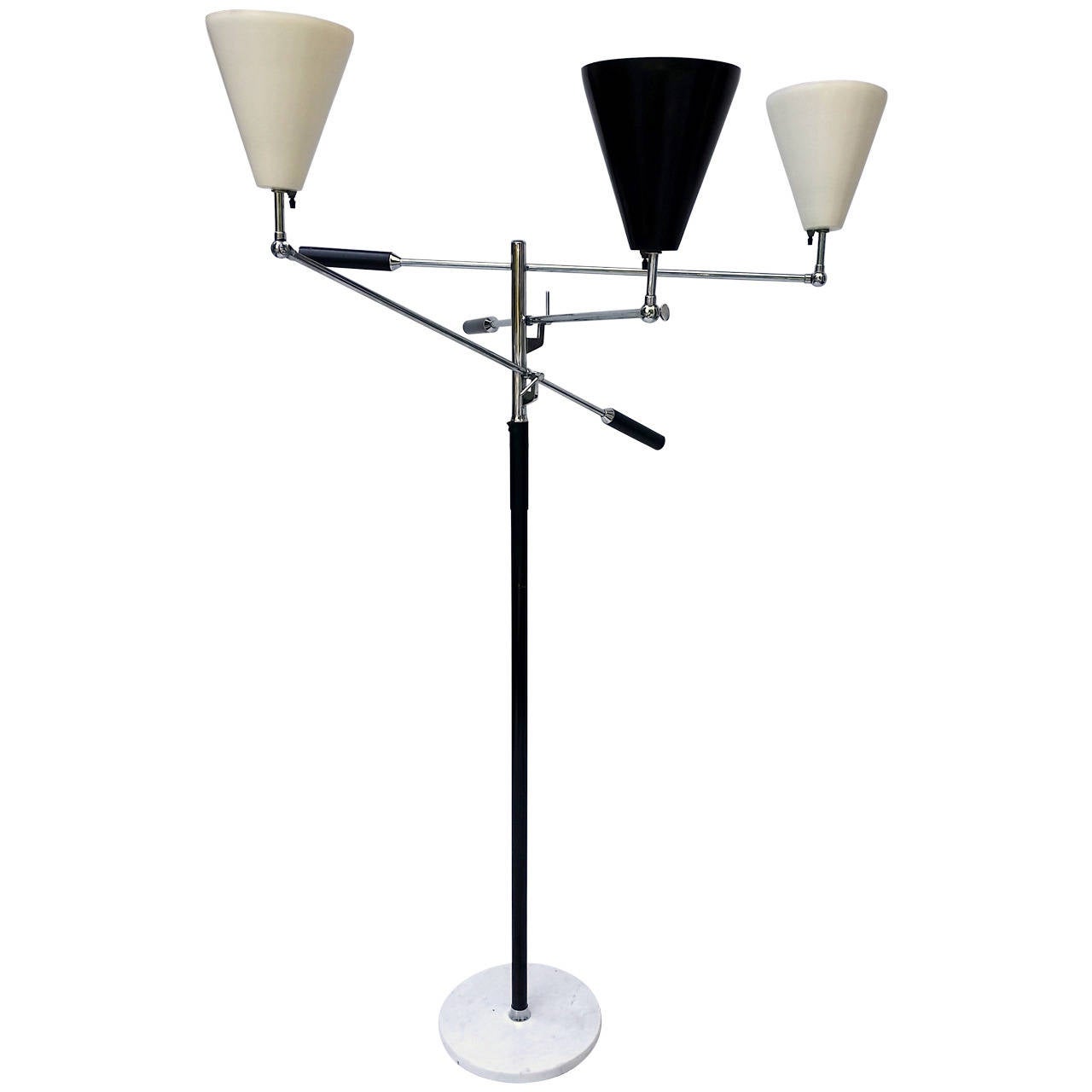 One of the classic Italian lighting designs of the 20th century designed by Angelo Lelli for Arredoluce in 1952. this lamp dates from the late 1950's. .
Leather cased handles and leather hand grip on center pole. Stamped made in Italy on the top of
