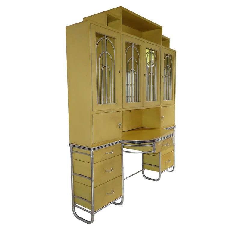 A spectacular example of Warren McArthur's art deco case work. c

This impressive art moderne desk with its  bookcase and storage compartments H.84